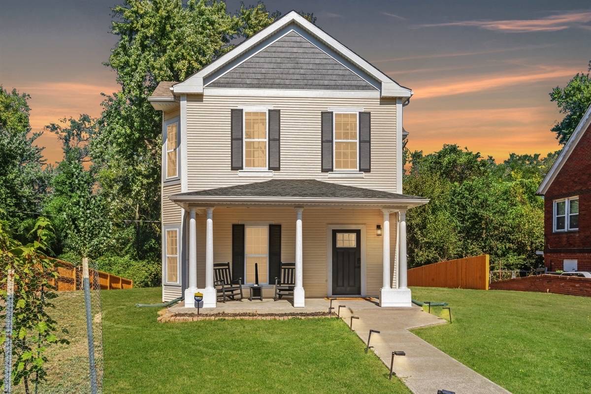 Restored 1921 home with white columns and front porch in Alton Illinois
